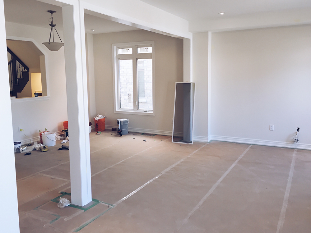 living-room-with-covered-flooring-during-home-reno-2022-11-14-06-09-13-utc